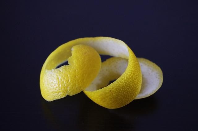 Should lemon peels be discarded in the trash